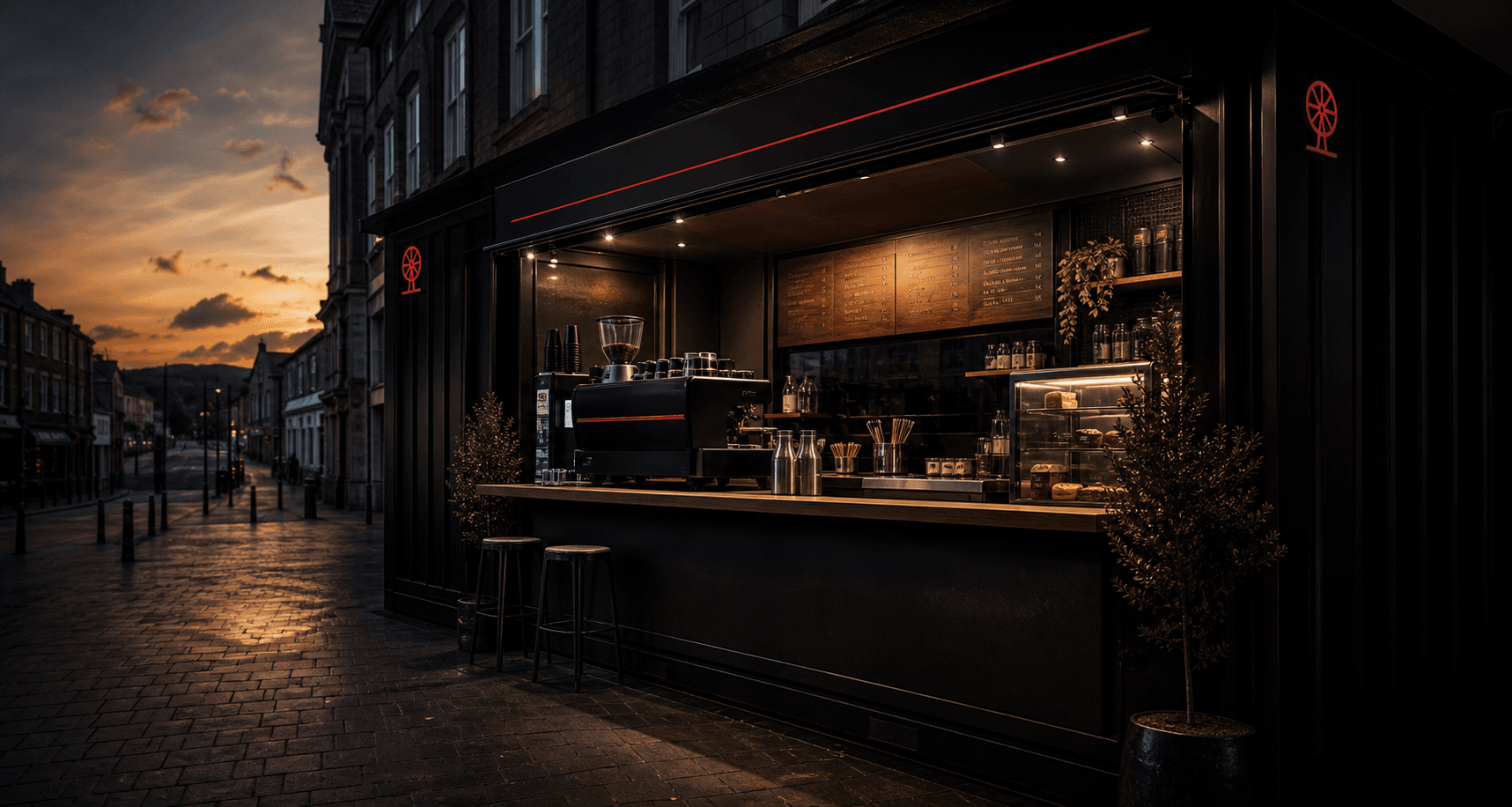 Dark Pithead-style coffee kiosk at dusk with warm interior light
